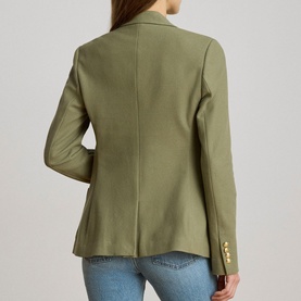 Model wearing Lauren jacket in Light Agave, back view, gold buttons at cuffs, styled with blue jeans