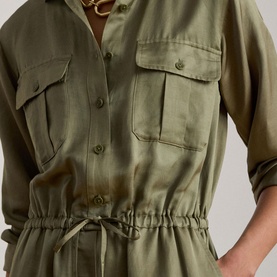 Model wearing Lauren jumpsuit in Light Agave, featuring chest pockets, button-front, and elasticated drawstring waist