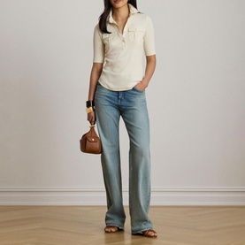 Model wearing Lauren Mascarpone Cream knit polo top with light wash wide-leg jeans, brown mini bag and tan sandals