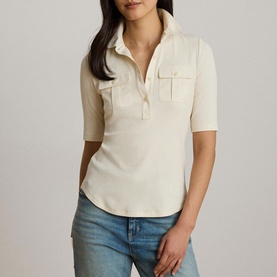 Model wearing Lauren Mascarpone Cream knit polo top with elbow sleeves and chest pockets, styled with blue jeans