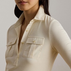 Model wearing Lauren knitwear in Mascarpone Cream, close-up of polo collar and chest patch pockets with button detail.