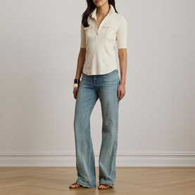 Model wearing Lauren Mascarpone Cream knit polo top with elbow sleeves, styled with light-wash wide-leg jeans and tan sandals.