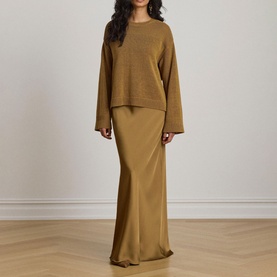 Model wearing Lauren Tobacco Bronze oversized knit sweater with wide sleeves, styled with a matching satin maxi skirt.