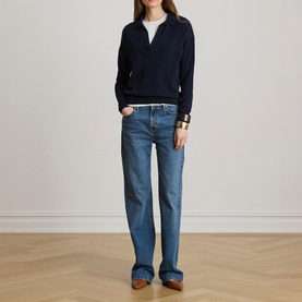 Model wearing Lauren navy knit polo top with open collar, styled with light blue straight-leg jeans and brown loafers