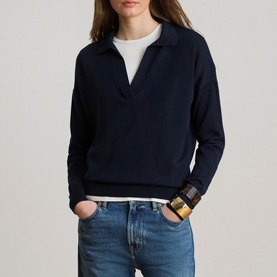 Model wearing Lauren navy knit polo sweater, styled with light wash jeans and a gold cuff bracelet