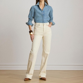 Model wearing Lauren shirt in Alicia Wash denim, styled with cream wide-leg jeans and brown leather boots