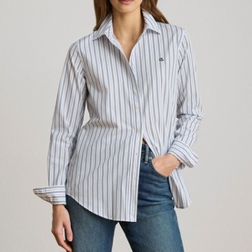 Model wearing Lauren blue multi stripe shirt with pointed collar, styled with blue jeans