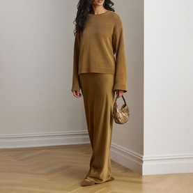 Model wearing Lauren Tobacco Bronze skirt, styled with matching knit jumper and gold mini bag
