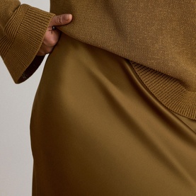 Lauren Tobacco Bronze satin midi skirt, styled with matching ribbed knit jumper, close-up detail shot