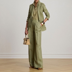 Model wearing Lauren Light Agave wide-leg trousers, styled with matching blazer, khaki shirt and small tan top-handle bag.