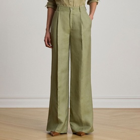 Model wearing Lauren Light Agave wide-leg pleated trousers, styled with a matching relaxed shirt