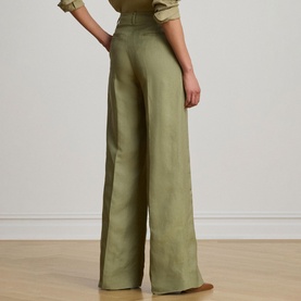 Model wearing Lauren wide-leg trousers in Light Agave, shown from behind, styled with a matching relaxed shirt