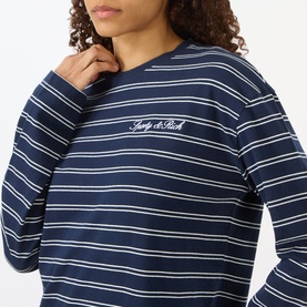 Model wearing Sporty and Rich dark navy and white striped long-sleeve T-shirt with cursive logo embroidery at chest