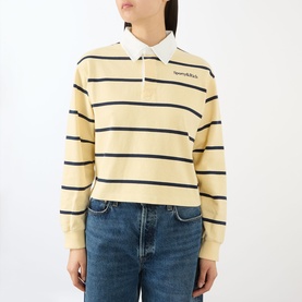Model wearing Sporty and Rich Almond Navy striped cotton rugby polo top, cropped fit, styled with blue denim jeans.