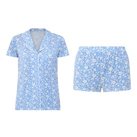 Stripe & Stare La Jardin Bleu pyjama set in blue floral print, short-sleeve button-front top and matching shorts