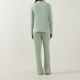 Model wearing Stripe & Stare Classic Scallop Trim Pyjama Set in Eucalyptus Pastels, back view, long-sleeve top and straight-leg trousers