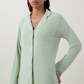 Model wearing Stripe & Stare Classic Scallop Trim Pyjama Set in Eucalyptus Pastels, showing notched lapels, long sleeves and scalloped trim detail.