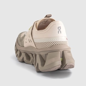 On Running trainer in Sand Desert, rear view showing chunky sculpted sole and mesh heel panel with logo tab.