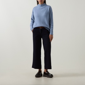 Model wearing Elena Miro Brushed Knitted Sweater in Frost with high neck and ribbed trims, styled with navy wide-leg trousers and black loafers.