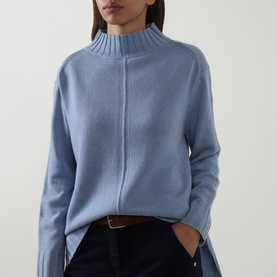 Model wearing Elena Miro Brushed Knitted Sweater in Frost, featuring high neck, dropped shoulders and ribbed trims, styled with dark trousers and