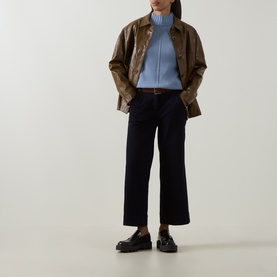 Model wearing Elena Miro Brushed Knitted Sweater in Frost with navy wide-leg trousers, brown jacket and black loafers