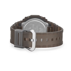 Casio digital watch in brown-black, rear view showing square case, rubber strap, and silver-tone buckle clasp