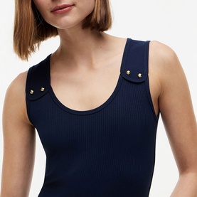 Model wearing Tommy Hilfiger Dark Night Navy ribbed tank top with gold stud shoulder details, scoop neckline, close-up view.
