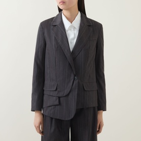 Model wearing HIGH Shimmy Layered Pinstripe Blazer in grey, single-breasted with notch lapel and asymmetric hem, styled with white shirt and grey