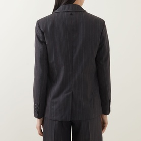 Model wearing HIGH Shimmy Layered Pinstripe Blazer in grey wool, rear view showing single-breasted silhouette, buttoned cuffs and rear vent
