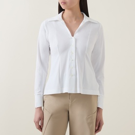 Model wearing HIGH Behave Slim Shirt in white with V-neckline, button front and fitted silhouette, styled with beige trousers