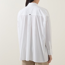 Model wearing HIGH Tumble Down Oversized Shirt in white, rear view showing back pleat, dropped shoulders, and buttoned cuffs