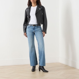 Model wearing Mother Wide Leg Jeans in Leap At The Chance, styled with black leather biker jacket, white tee and black heeled boots.