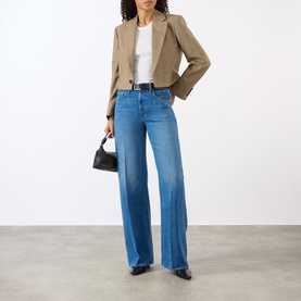 Model wearing Mother The Lasso Sneak Wide-Leg Jeans in Breaking New Ground, styled with a cropped blazer, white tee and black mini bag.