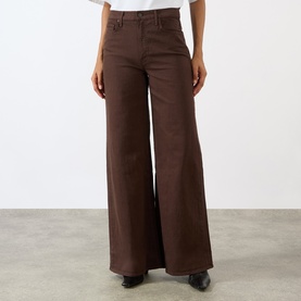 Model wearing Mother Wide Leg Jeans in Decadent Chocolate, high-rise with flared wide-leg silhouette in 100% cotton denim.