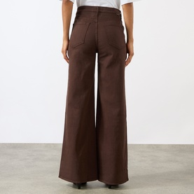Model wearing Mother Wide Leg Jeans in Decadent Chocolate, rear view showing high waist, wide-leg silhouette and back pockets in 100% cotton denim.
