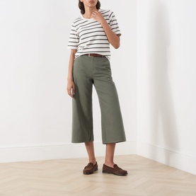 Model wearing Part Two Beetle Stripe cotton T-shirt with khaki wide-leg cropped trousers, brown belt and loafers.