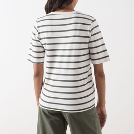 Model wearing Part Two Beetle Stripe cotton T-shirt, rear view, with olive green trousers.