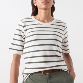 Model wearing Part Two Beetle Stripe cotton T-shirt with crew neck and short sleeves, styled with olive trousers and brown belt.