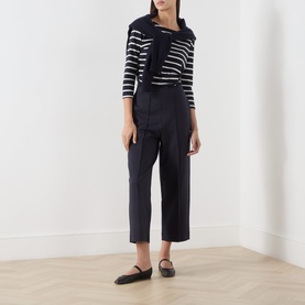 Model wearing Part Two Navy/Eggnog Stripe cotton top with navy wide-leg cropped trousers and black flat shoes.