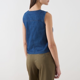 Model wearing Part Two medium dark blue sleeveless cotton top, back view, styled with khaki trousers.