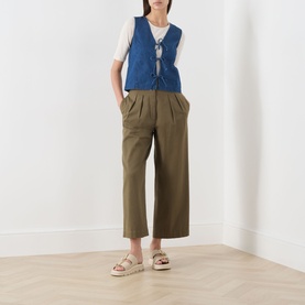 Model wearing Part Two Medium Dark Blue cotton vest top with olive wide-leg cropped trousers and white platform sandals.