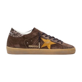 Golden Goose brown suede low-top trainers with yellow star patch, glitter heel tab, and gum rubber sole