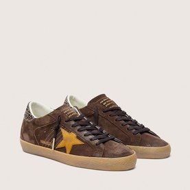 Golden Goose brown suede low-top trainers with gold star detail, leopard print heel tab, and gum sole