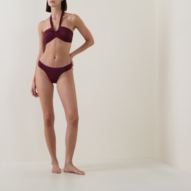 Model wearing Seafolly Dark Burgundy Bikini Brief with matching halterneck bandeau top, full body shot on neutral background.