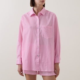 Model wearing Seafolly light pop pink cotton striped oversized shirt cover-up with chest pocket and long sleeves