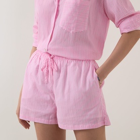 Model wearing Seafolly Light Pop Pink cotton striped shorts with drawstring waist, styled with matching striped shirt