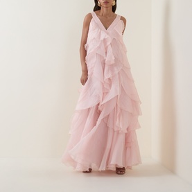 Model wearing Aje Athena Ruffle Gown in Tea Blossom, sleeveless maxi dress with V-neckline and tiered ruffles throughout