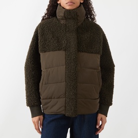 Model wearing HIGH olive padded coat with teddy fleece upper, high neck, and quilted body panels