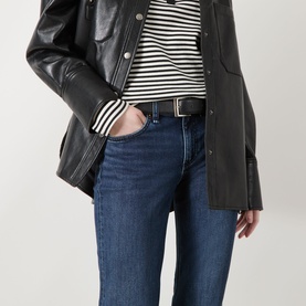 Model wearing Rag & Bone bootcut jeans in lulu denim, styled with a striped top and black leather jacket.