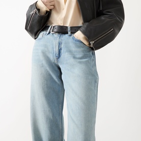 Model wearing Rag & Bone straight leg jeans in light blue denim, styled with black leather jacket and black belt.